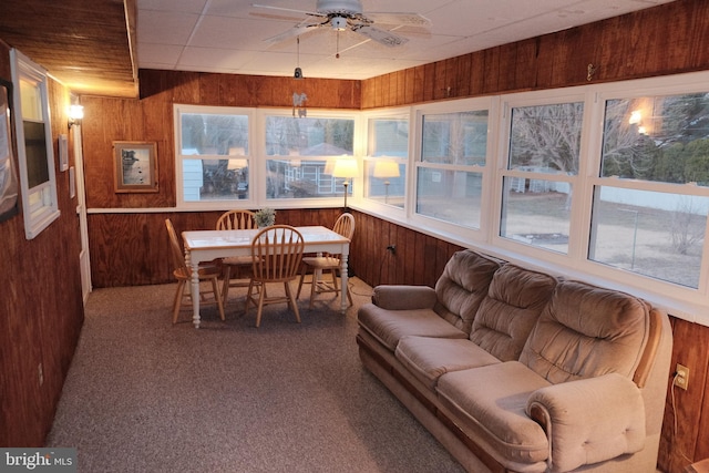 sunroom / solarium featuring a paneled ceiling and ceiling fan