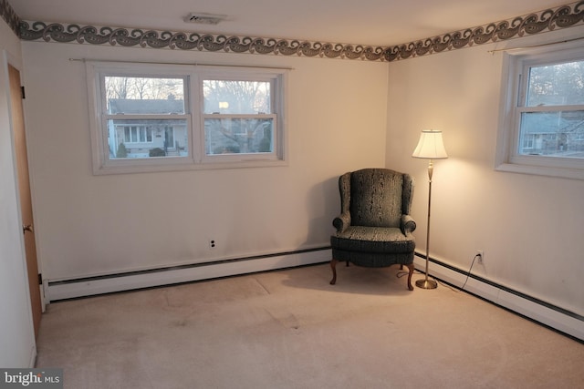 unfurnished room with baseboard heating, carpet flooring, and visible vents