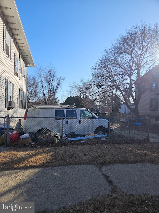 view of yard featuring a fenced front yard and cooling unit