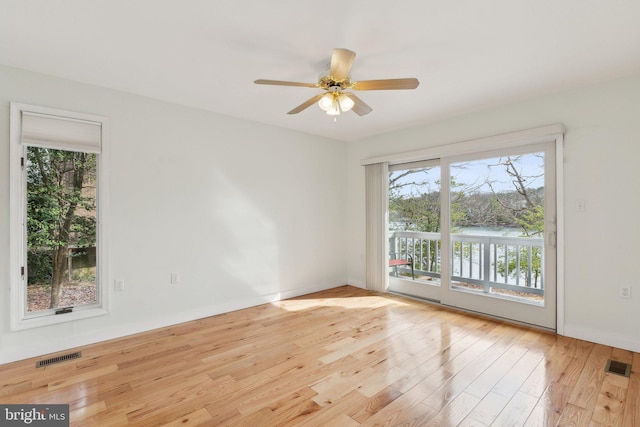 12106 Preston Dr, Lusby, MD 20657 - empty room featuring visible vents, a ceiling fan, baseboards, and wood finished floors