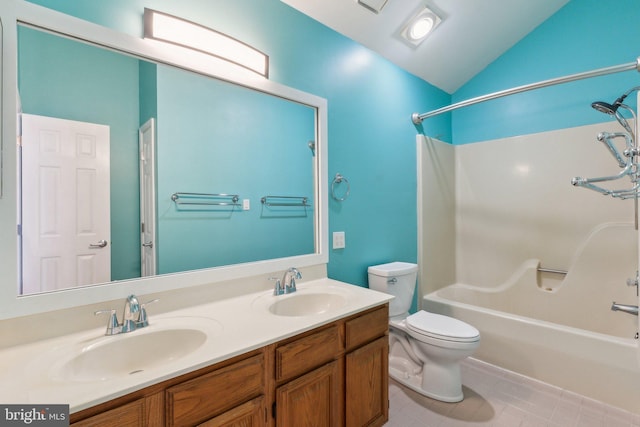 12106 Preston Dr, Lusby, MD 20657 - full bath with a sink, double vanity, toilet,  shower combination, and vaulted ceiling