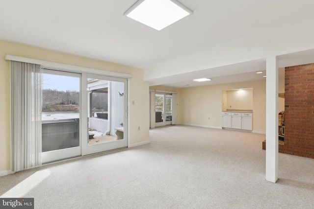 12106 Preston Dr, Lusby, MD 20657 - unfurnished living room with baseboards and carpet flooring