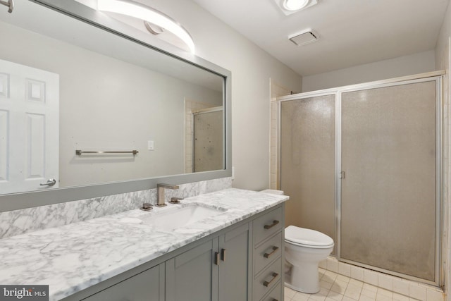 12106 Preston Dr, Lusby, MD 20657 - full bath with vanity, tile patterned floors, a shower stall, and toilet