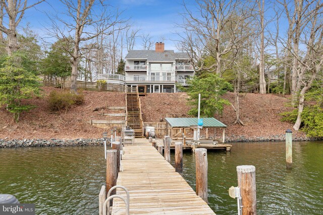 12106 Preston Dr, Lusby, MD 20657 - view of dock with stairs, a water view, and a balcony