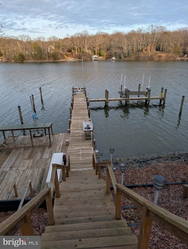 view of dock featuring a water view and boat lift