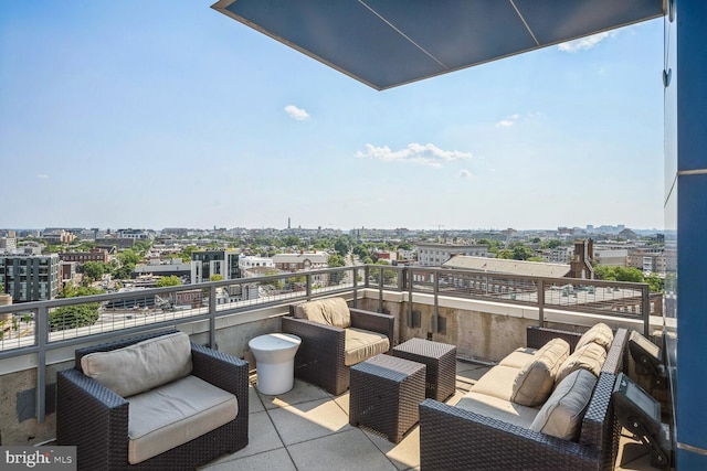 balcony featuring a view of city and outdoor lounge area