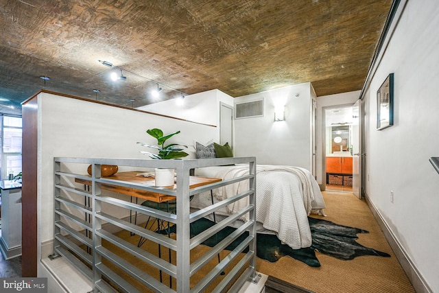 interior space with carpet floors, baseboards, and visible vents