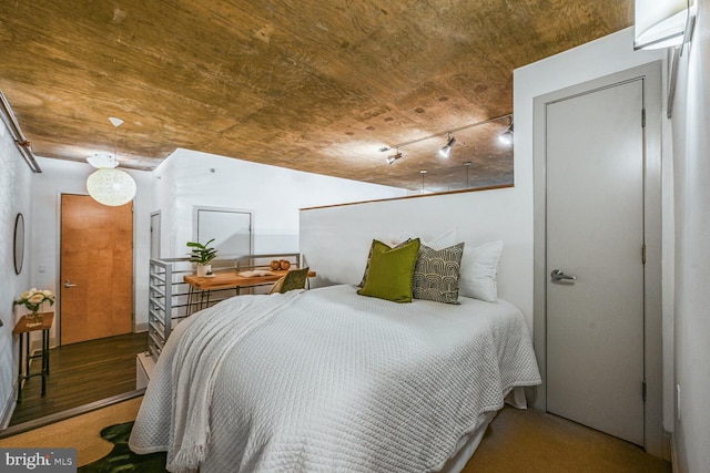 bedroom with wood finished floors