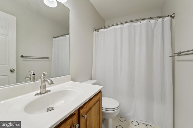 full bathroom featuring vanity and toilet