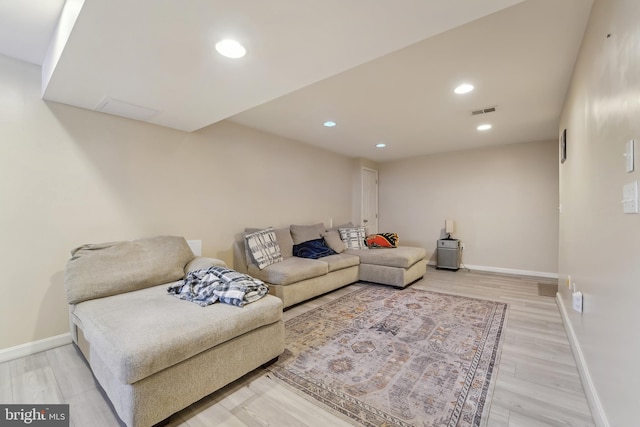 living area featuring recessed lighting, wood finished floors, visible vents, and baseboards