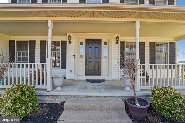 doorway to property with a porch