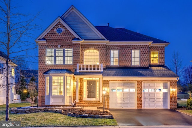 view of front of property with a garage, brick siding, driveway, and roof with shingles