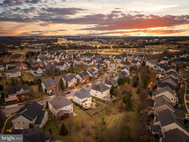 aerial view at dusk with a residential view