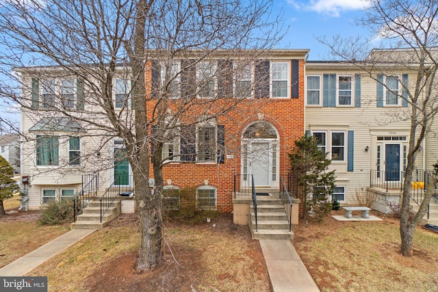 view of property with brick siding