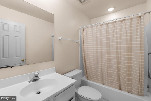 full bathroom with toilet, visible vents, shower / bath combination with curtain, and vanity