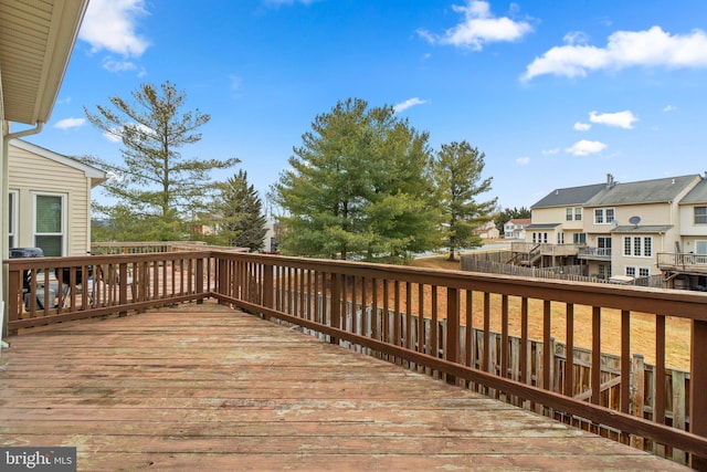 wooden deck featuring a residential view