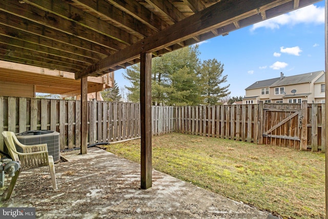 view of patio featuring central AC unit, a fenced backyard, and a gate