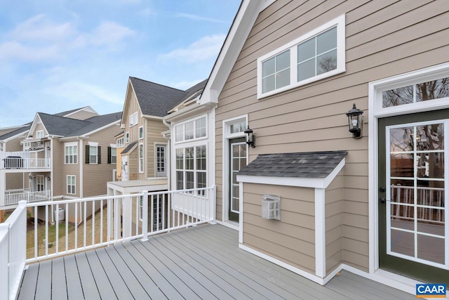 wooden deck with a residential view