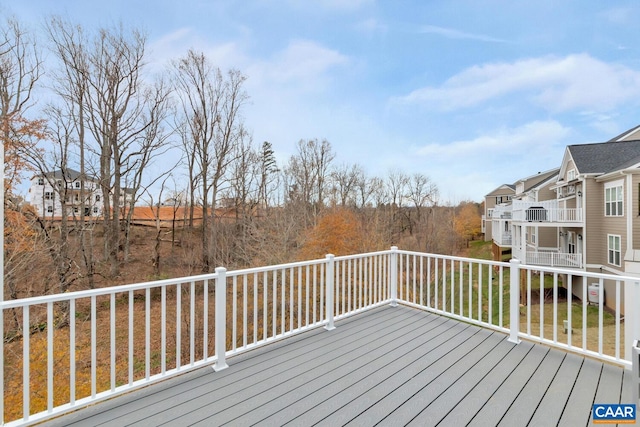 wooden terrace with a residential view