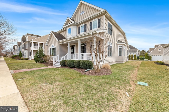 view of front facade with a porch, a front lawn, and a residential view