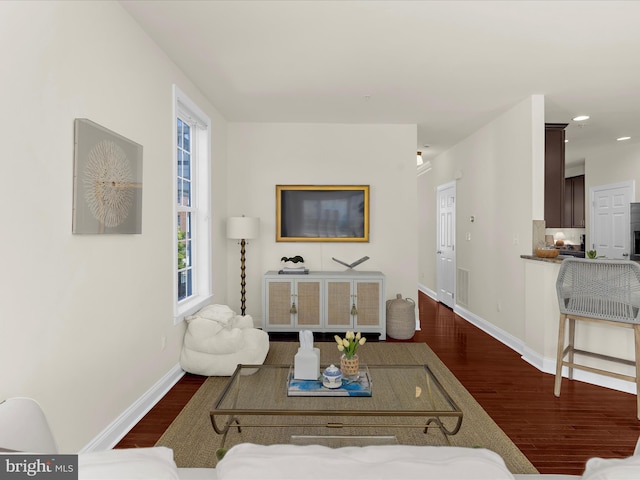 8512 Pine Springs Dr, Severn, MD 21144 - living area with dark wood-style flooring, baseboards, and recessed lighting