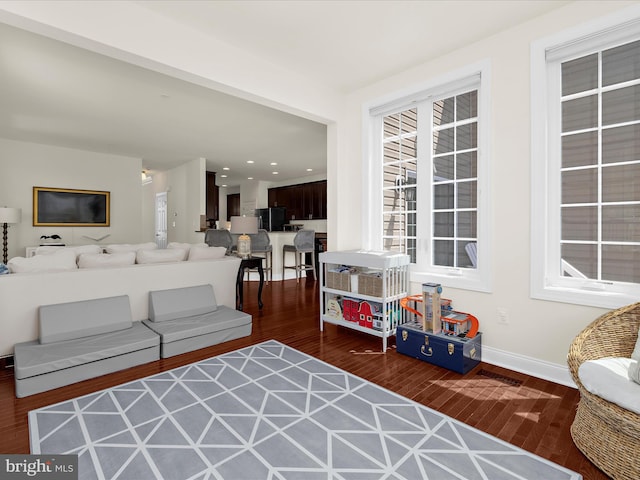 8512 Pine Springs Dr, Severn, MD 21144 - living room featuring wood finished floors, baseboards, and recessed lighting