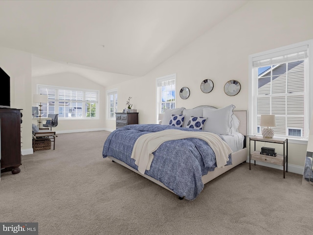 8512 Pine Springs Dr, Severn, MD 21144 - carpeted bedroom with vaulted ceiling, multiple windows, and baseboards