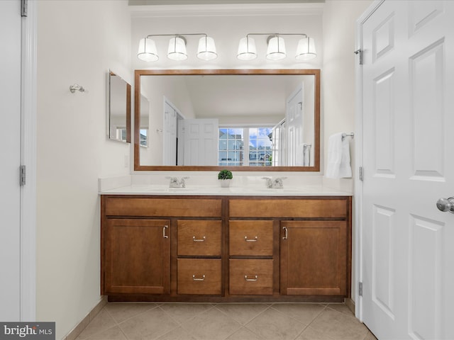 8512 Pine Springs Dr, Severn, MD 21144 - bathroom with double vanity, ornamental molding, tile patterned flooring, and baseboards
