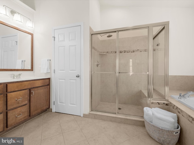 8512 Pine Springs Dr, Severn, MD 21144 - full bathroom with a shower stall, tile patterned floors, vanity, and a relaxing tiled tub