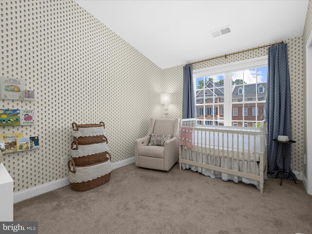 8512 Pine Springs Dr, Severn, MD 21144 - carpeted bedroom featuring baseboards, wallpapered walls, vaulted ceiling, and a nursery area