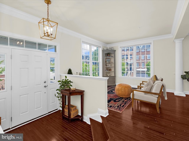 8512 Pine Springs Dr, Severn, MD 21144 - foyer featuring ornamental molding, wood finished floors, baseboards, ornate columns, and a chandelier