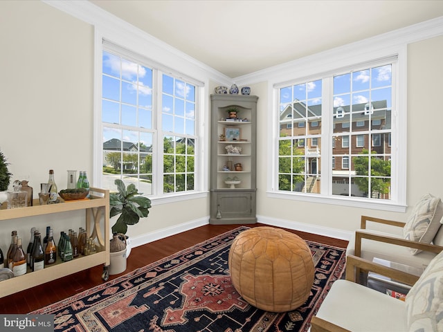 8512 Pine Springs Dr, Severn, MD 21144 - living area featuring dark wood-style flooring, baseboards, crown molding, and plenty of natural light