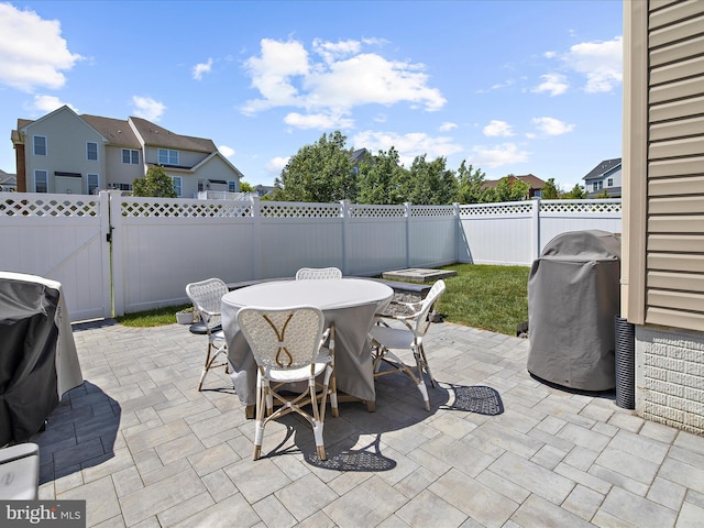 8512 Pine Springs Dr, Severn, MD 21144 - view of patio / terrace featuring outdoor dining space, a fenced backyard, a gate, and a residential view