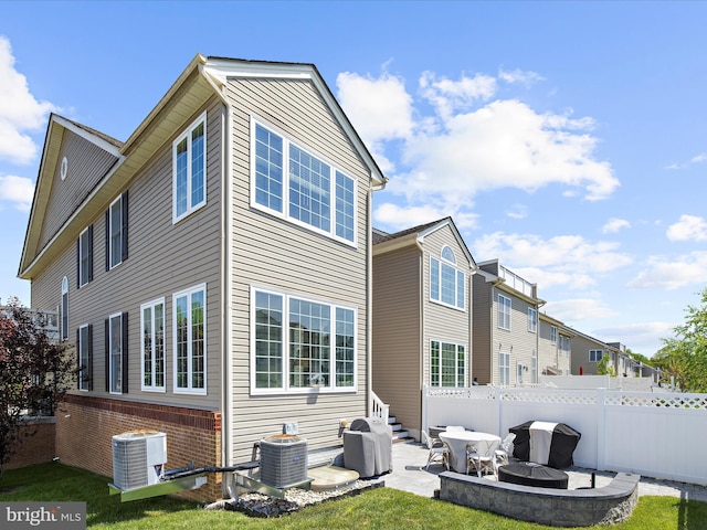 8512 Pine Springs Dr, Severn, MD 21144 - rear view of house featuring central AC unit and a patio