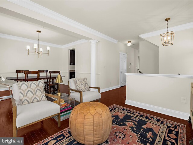 8512 Pine Springs Dr, Severn, MD 21144 - living area with a chandelier, wood finished floors, crown molding, and baseboards