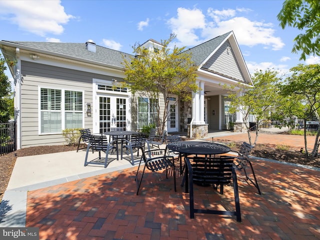 8512 Pine Springs Dr, Severn, MD 21144 - view of patio / terrace featuring french doors, outdoor dining space, and fence