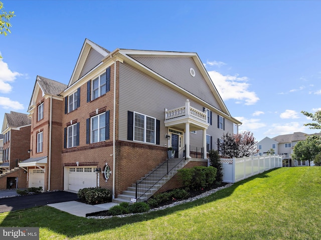 8512 Pine Springs Dr, Severn, MD 21144 - view of home's exterior with a garage, a balcony, brick siding, asphalt driveway, and a residential view
