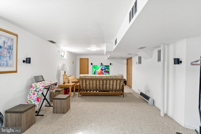 bedroom featuring visible vents and light carpet