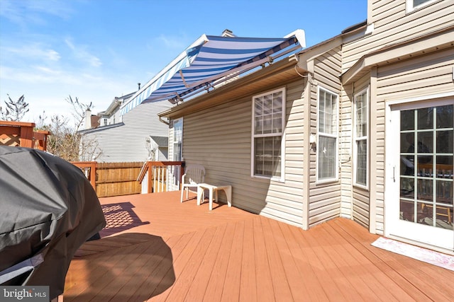 wooden terrace featuring grilling area