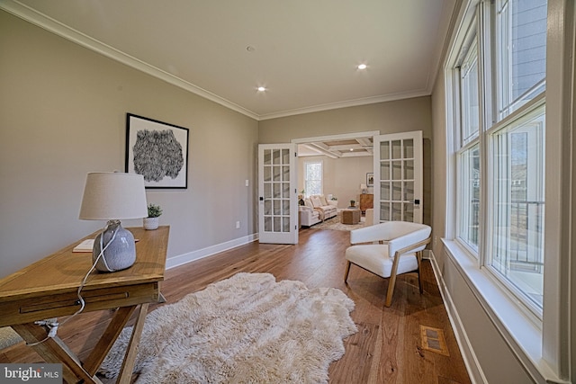 office area with french doors, visible vents, ornamental molding, wood finished floors, and baseboards