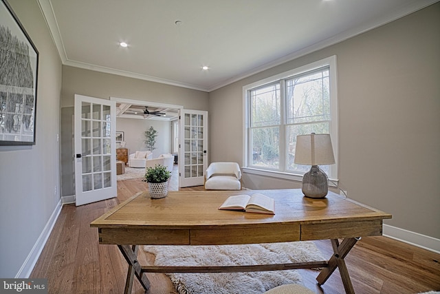 office area with baseboards, french doors, wood finished floors, and crown molding