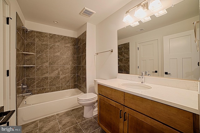 bathroom featuring tile patterned flooring, toilet, vanity, visible vents, and  shower combination