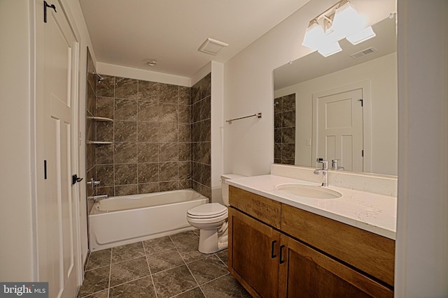 full bath featuring toilet, bathing tub / shower combination, visible vents, and vanity