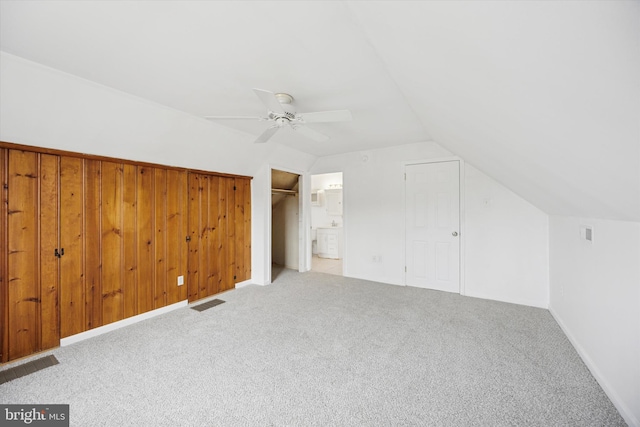 bonus room with ceiling fan, visible vents, vaulted ceiling, and carpet flooring