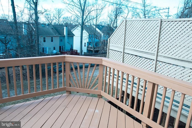 wooden deck featuring a residential view