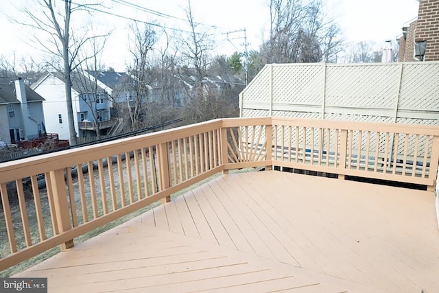 wooden deck with a residential view