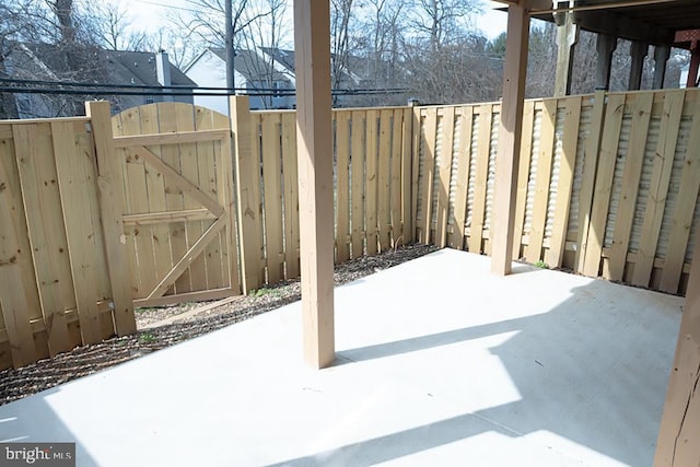 view of patio / terrace featuring a gate and fence