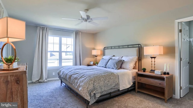 bedroom with carpet, ceiling fan, and baseboards