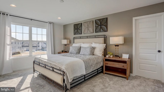 carpeted bedroom with recessed lighting