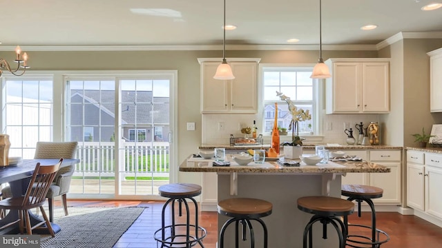 kitchen with dark wood-style floors, white cabinetry, ornamental molding, and decorative backsplash